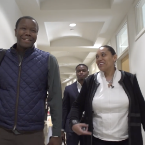 People walking through a corridor 