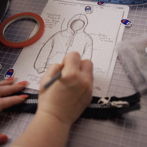 A person drawing a hoodie 