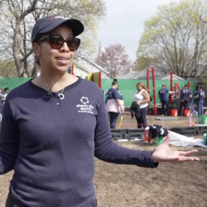 A person stood in front of a playground being built 