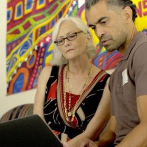 People looking at a laptop screen