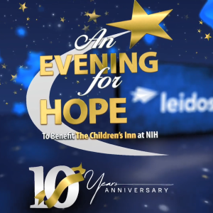 "An Evening for Hope" with stars on a dark blue background. Leidos logo behind.