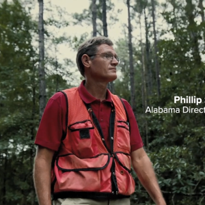 Phillip Smith in a wooded area.