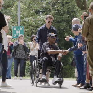 People shaking hands with a veteran 