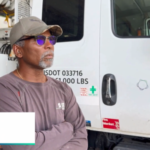 Paige Copes next to a lineworker truck.