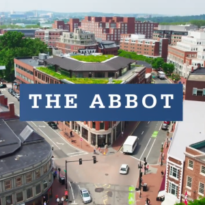 "The Abbot" over an aerial view of the building and surrounding area.