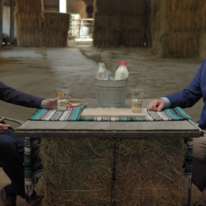 two men sitting at a table 