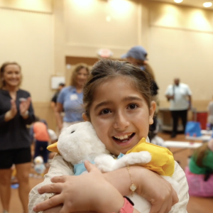Young girl shown holding her Aflac Duck.