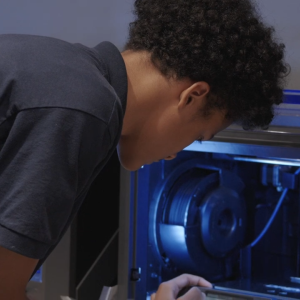 A student looking at a piece of technology