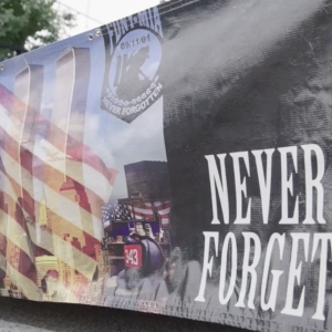 A banner with the text "never forget" 
