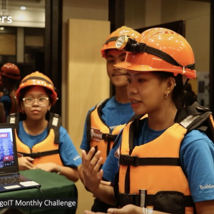 Instructor teaching students wearing safety gear