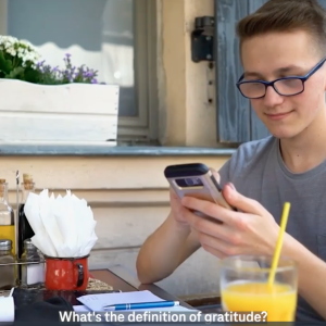 Person on phone at breakfast