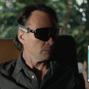 Walton Goggins holding smartphone with his picture on it