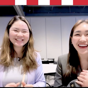 girls smiling into a screen