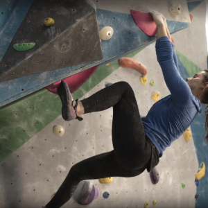 Alexandra Toth climbing a rock wall