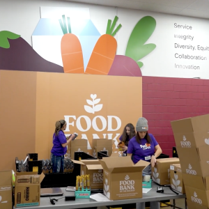Volunteers packing up boxes at the Food Bank