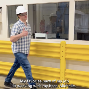 Factory worker giving thumbs up