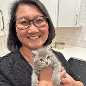 Holly holding a kitten.