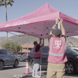 people working on a tent