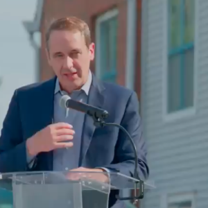 A person speaking at a podium