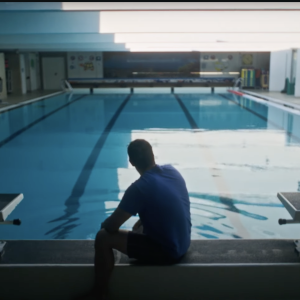 person in front of swimming pool