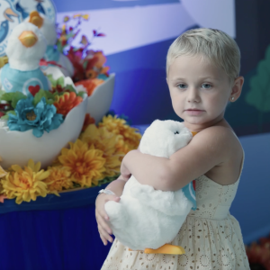 Young girl holding her Aflac My Special Duck