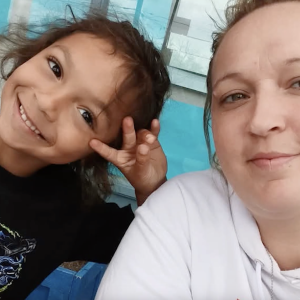 Smiling caregiver and child