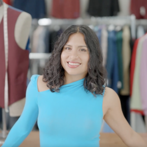 Naomi Romo in her family’s Miami clothing store, Anghelo’s Suit & Tux. Photo credit: Maggie M. Bailey