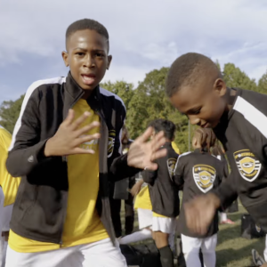 Young athletes on a playing field.