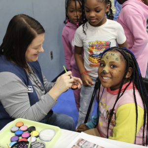 Children at a face painting activity