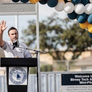 Landon Donovan speaking at podium