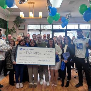 T&Q Nails receiving grant check from Fifth Third