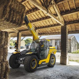 hybrid full-size telehandler prototype lifting hay