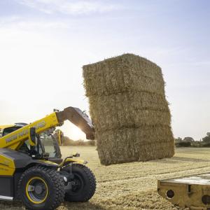 hybrid full-size telehandler prototype lifting hay