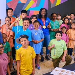 Group of students holding awards