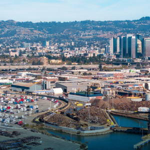 An aerial photo of a shipping yard and neighboring harbor