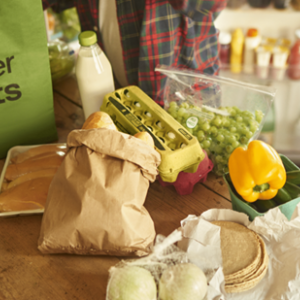A table with food on it and a bag that reads "Uber Eats"
