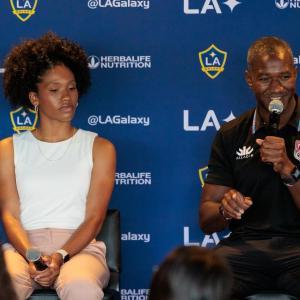 Denecia Fernandes and Marquise Goodwin answering a student's questions during the panel.