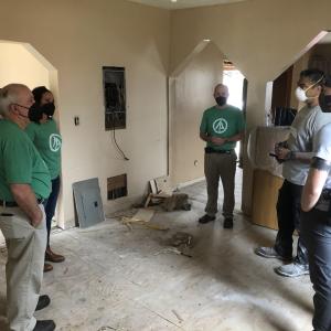 team of volunteers in a damaged home