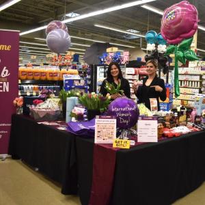 People posing at booths at Jewel-Osco's FABulous event