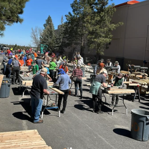 People working with lumber at the Sleep in Heavenly Peace event