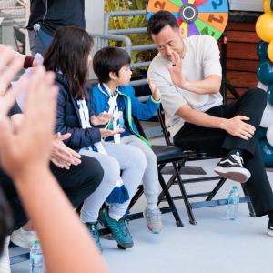 LA Galaxy's Maya Yoshida high-fives a participant.