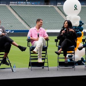 Seated people talking with each other on a stage