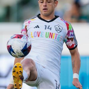 Chicharito warming up while wearing Pride Night jerseys.