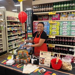A person in an apron at a store