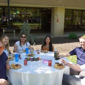 People sitting at table with food