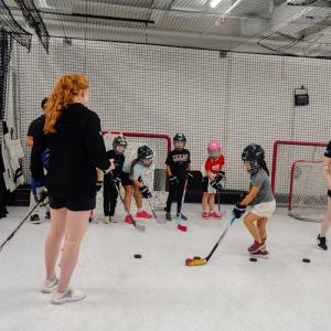 Participants build hockey fundamentals through an off-ice skills training exercise