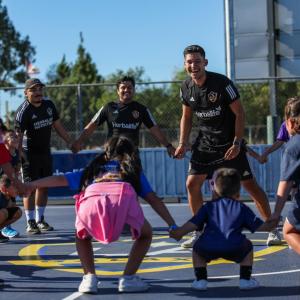 LA Galaxy players Jalen Neal, Edwin Cerrillo, and Mauricio Cuevas played with students on the new mini-pitch.