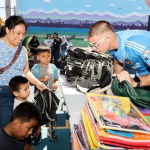 LA Galaxy's goalkeeper John McCarthy handed out school essentials to students for the upcoming academic year.