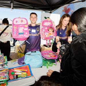 LA Galaxy's Tucker Lepley helped pass out backpacks to students in South Los Angeles.