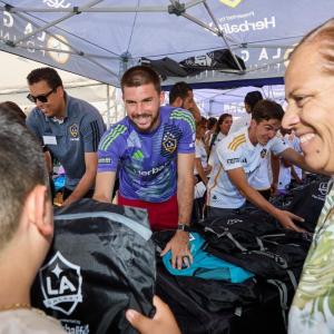 LA Galaxy players and staff helped distribute backpacks.